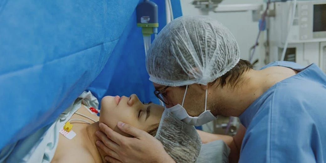 Couple in delivery room having a child.